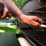 Any buildup on the grill will interfere with the clean-burning wood pellets