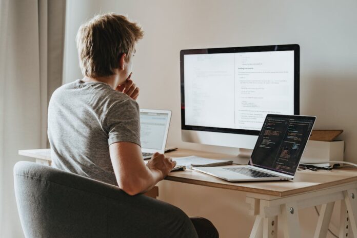 unsure person looking at laptop