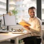 Businessman with A Laptop and A Book. Concept for Mca Education